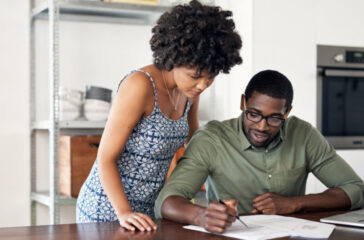 couple-looking-over-financial-documents.jpg