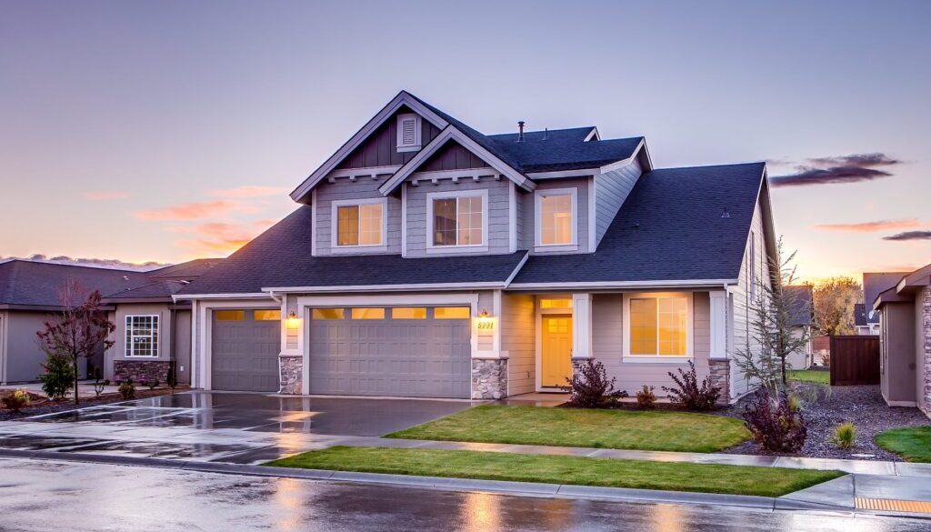 blue and gray concrete house with attic during twilight